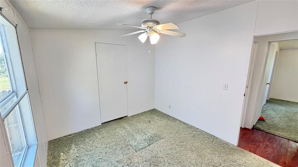 3789 Jacobs Lane Kaufman, TX 75142 - Photo 21 of 33 wooden floor in an empty room with a window