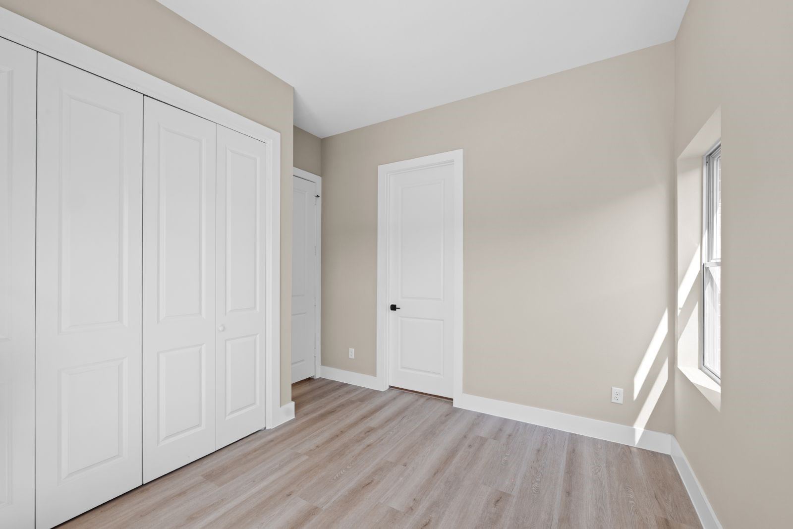 20023 Venetto Street Cir Spring Spring, TX 77388 - Photo 12 of 28 an empty room with wooden floor and a window