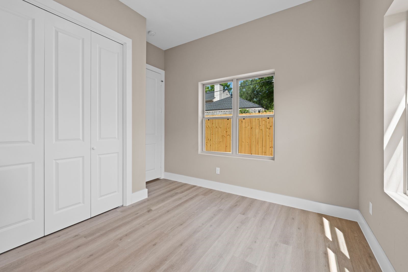 20023 Venetto Street Cir Spring Spring, TX 77388 - Photo 16 of 28 an empty room with wooden floor and windows