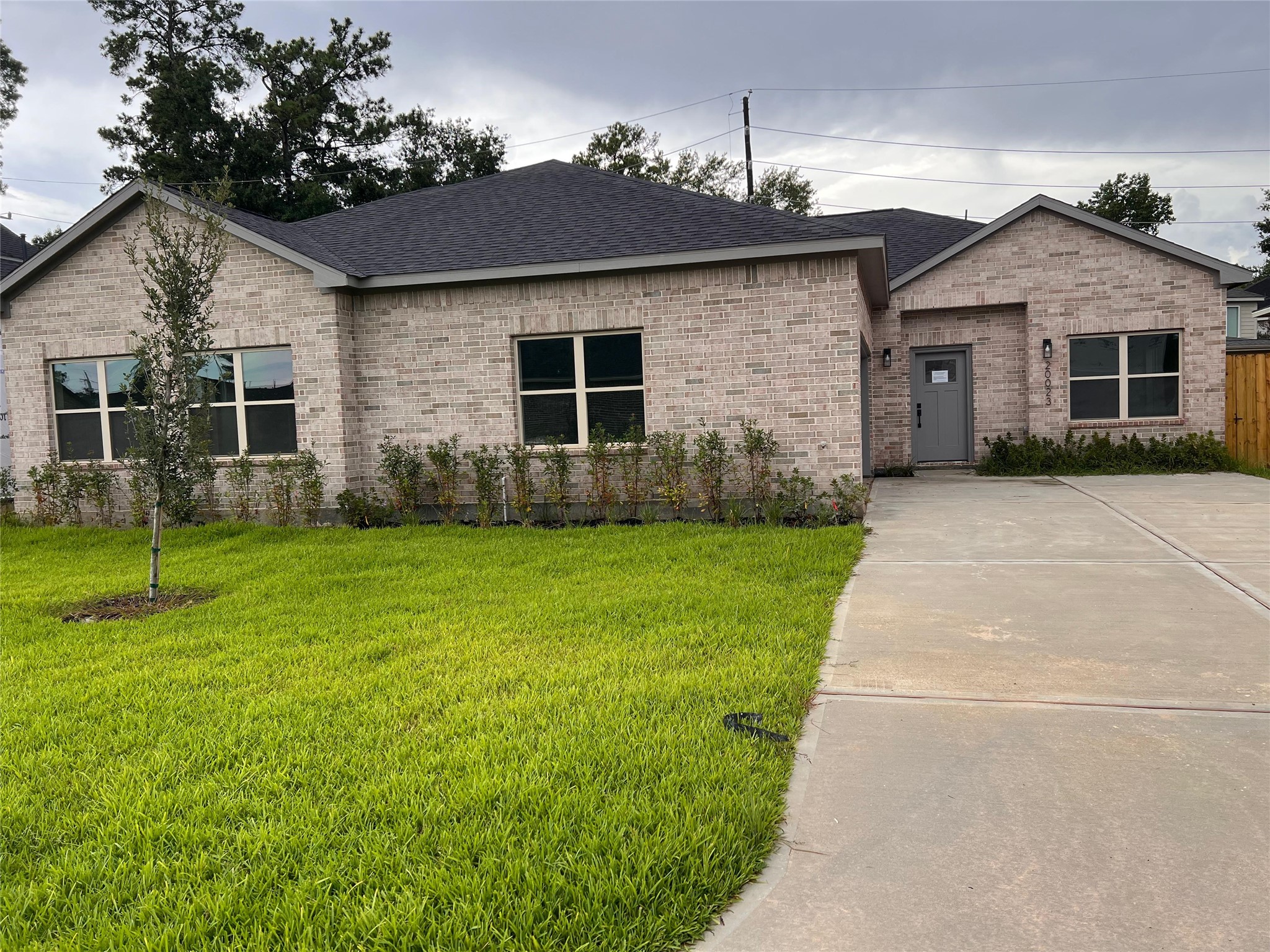 20023 Venetto Street Cir Spring Spring, TX 77388 - Photo 2 of 28 a front view of a house with garden