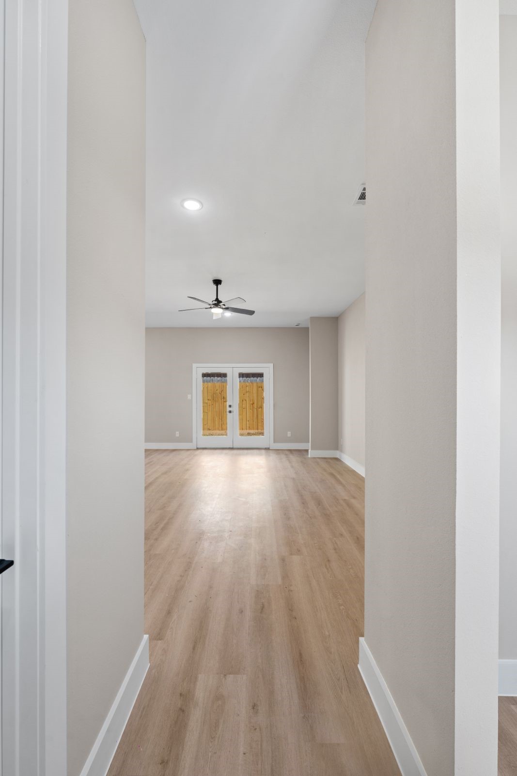 20023 Venetto Street Cir Spring Spring, TX 77388 - Photo 4 of 28 a view of an empty room with wooden floor and a window