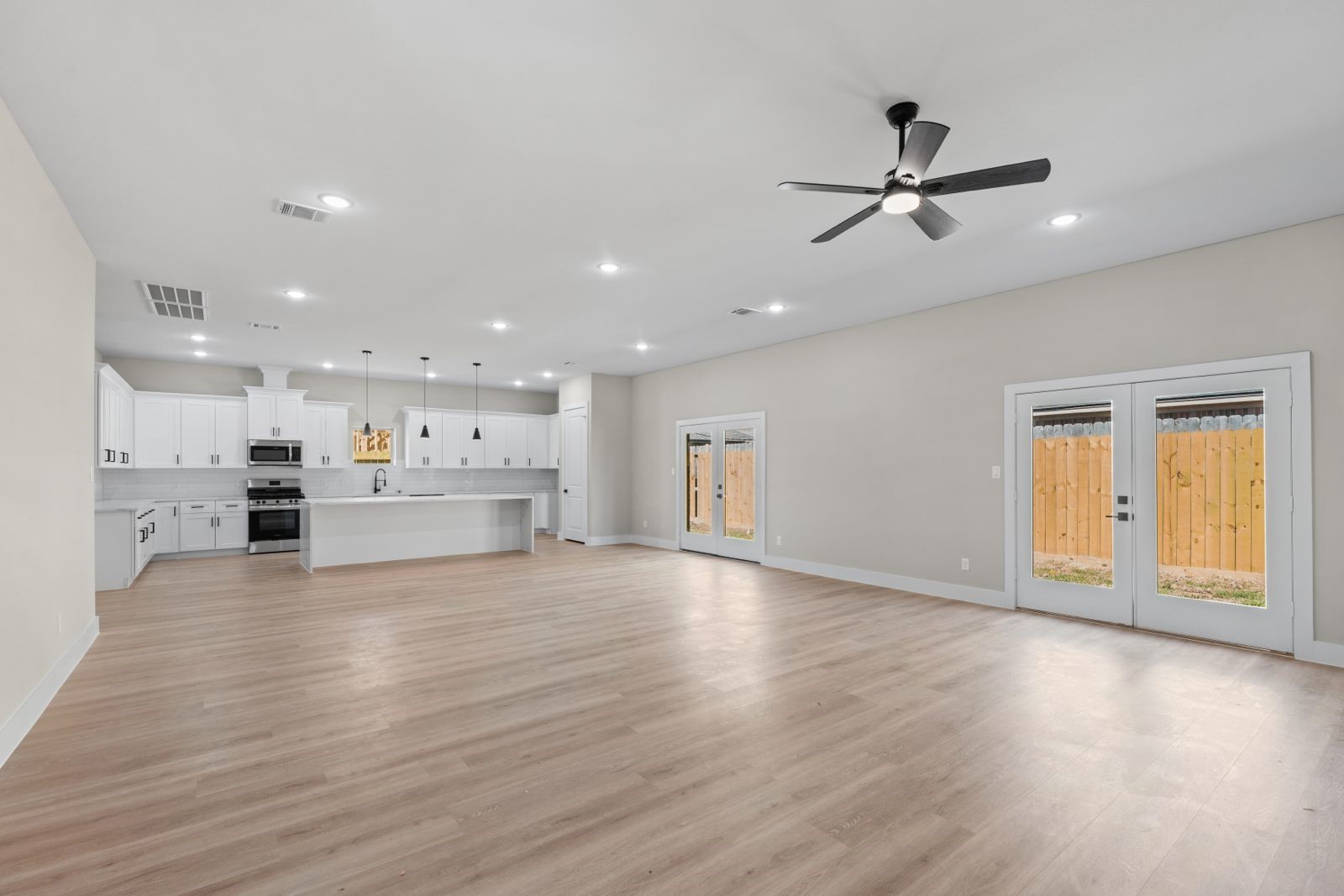 20023 Venetto Street Cir Spring Spring, TX 77388 - Photo 6 of 28 a view of a kitchen with a sink and wooden floor