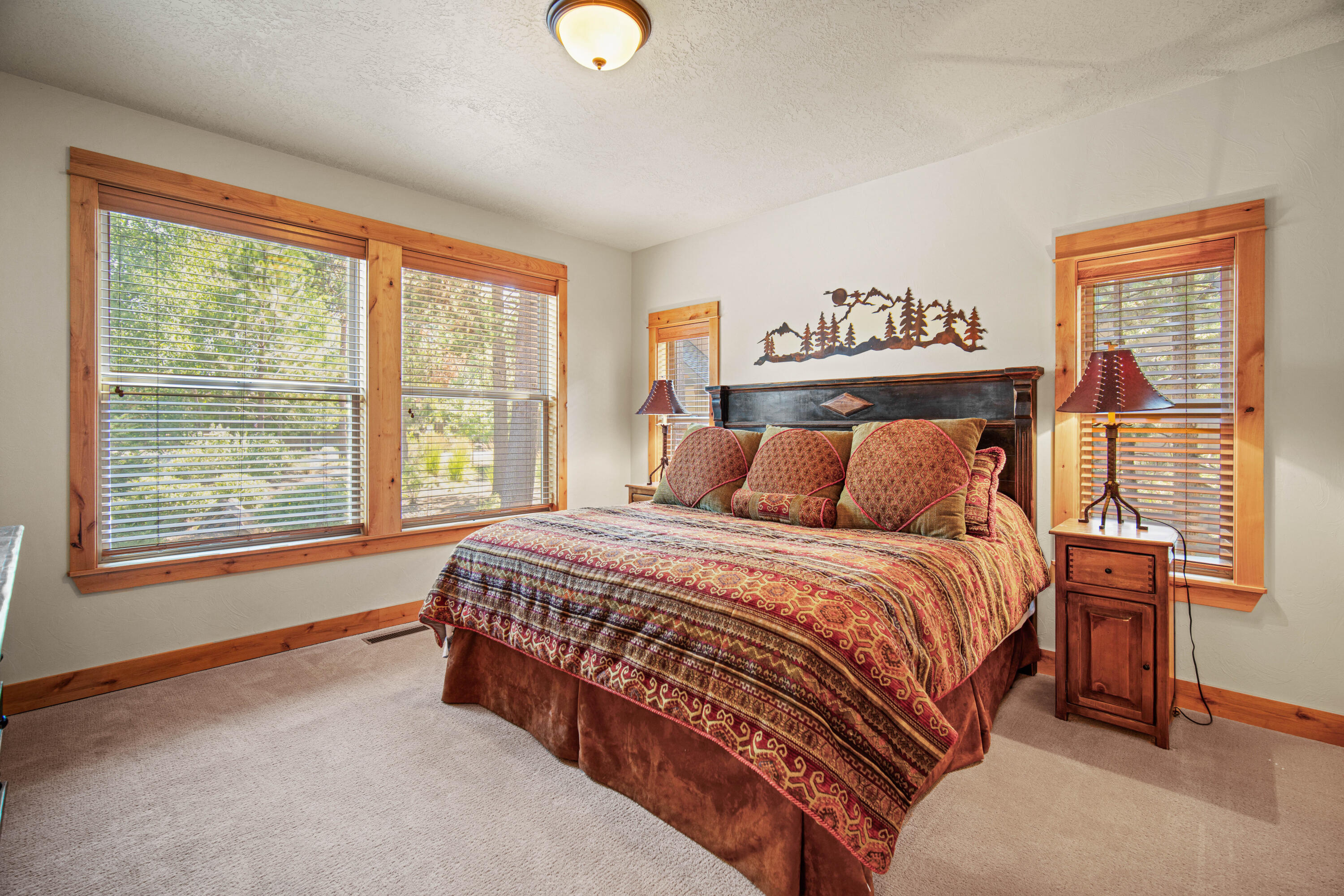 56689 Dancing Rock Loop Bend, OR 97707 - Photo 30 of 51 a bedroom with a bed and window