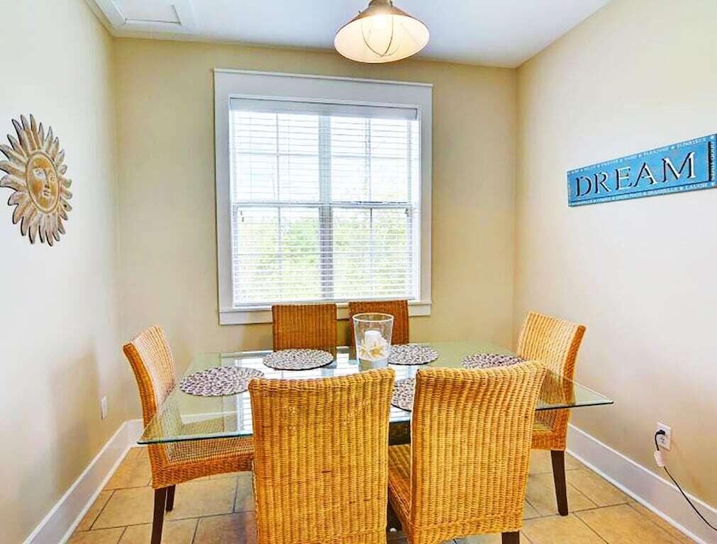198 Somerset Bridge Road, Unit 129 Santa Rosa Beach, FL 32459 - Photo 12 of 19 a view of a dining room with a table and chairs