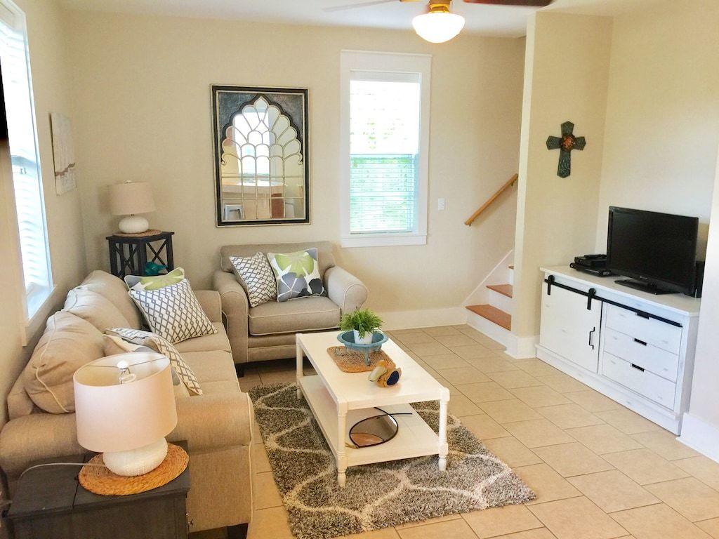 198 Somerset Bridge Road, Unit 129 Santa Rosa Beach, FL 32459 - Photo 10 of 19 a living room with furniture and a flat screen tv