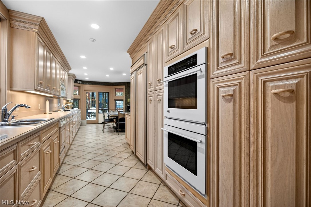 3498 Bainbridge Road Cleveland Heights, OH 44118 - Photo 13 of 50 Kitchen featuring double oven, recessed lighting, light countertops, paneled built in fridge, and light tile patterned floors
