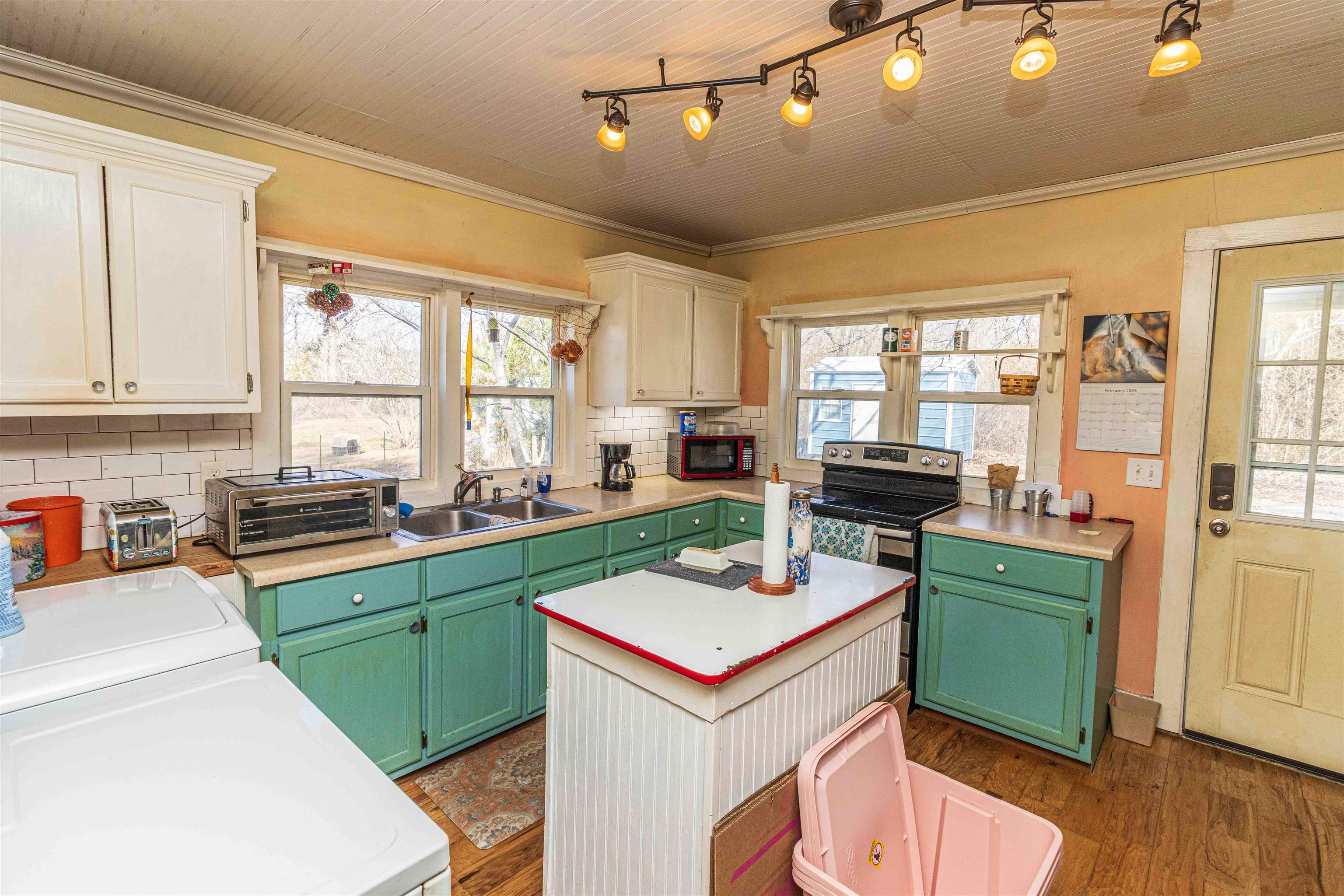 248 Mayflower Road Ramer, TN 38367 - Photo 11 of 31 a kitchen with a sink a stove and cabinets