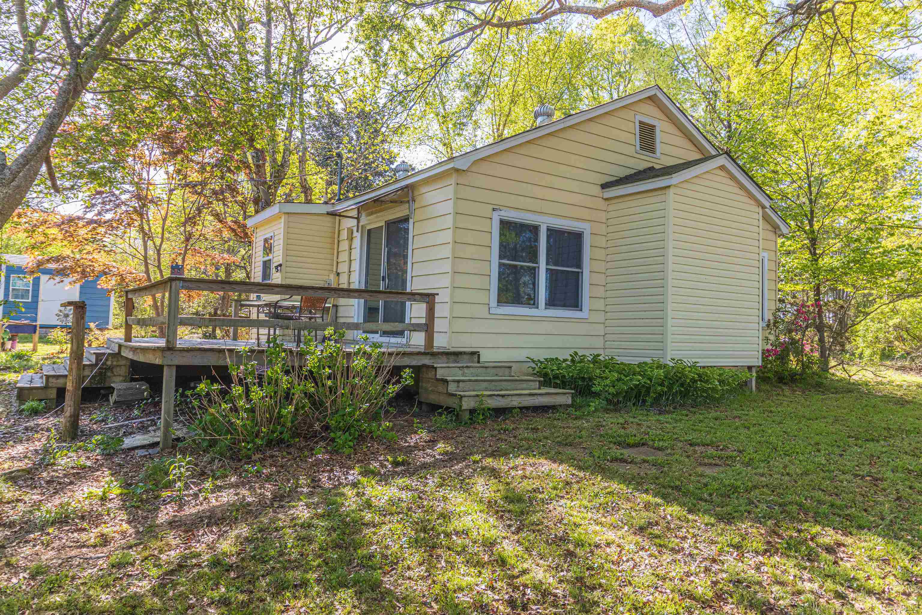 248 Mayflower Road Ramer, TN 38367 - Photo 25 of 31 a backyard of a house with table and chairs