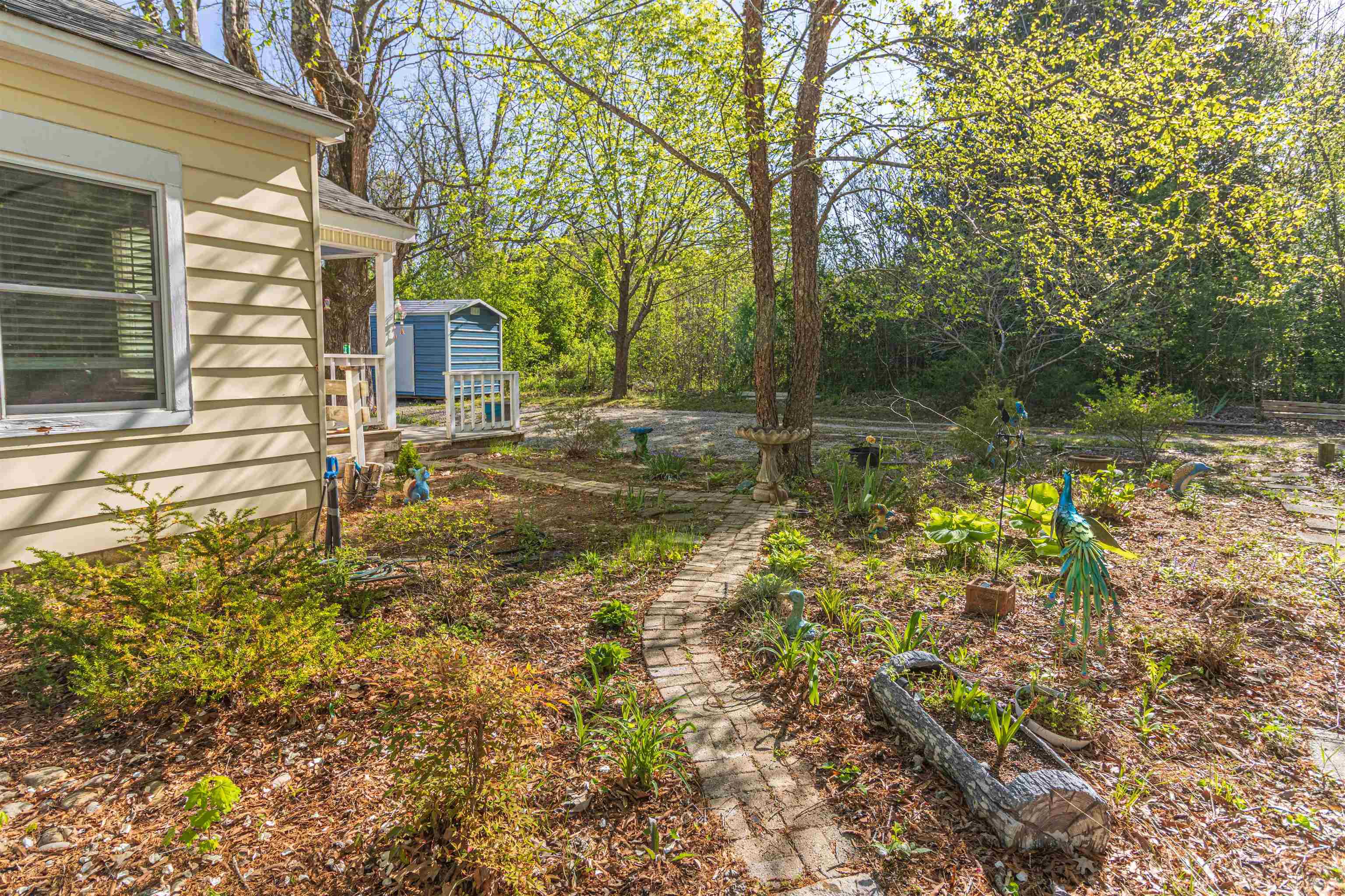 248 Mayflower Road Ramer, TN 38367 - Photo 27 of 31 a backyard of a house with lots of green space