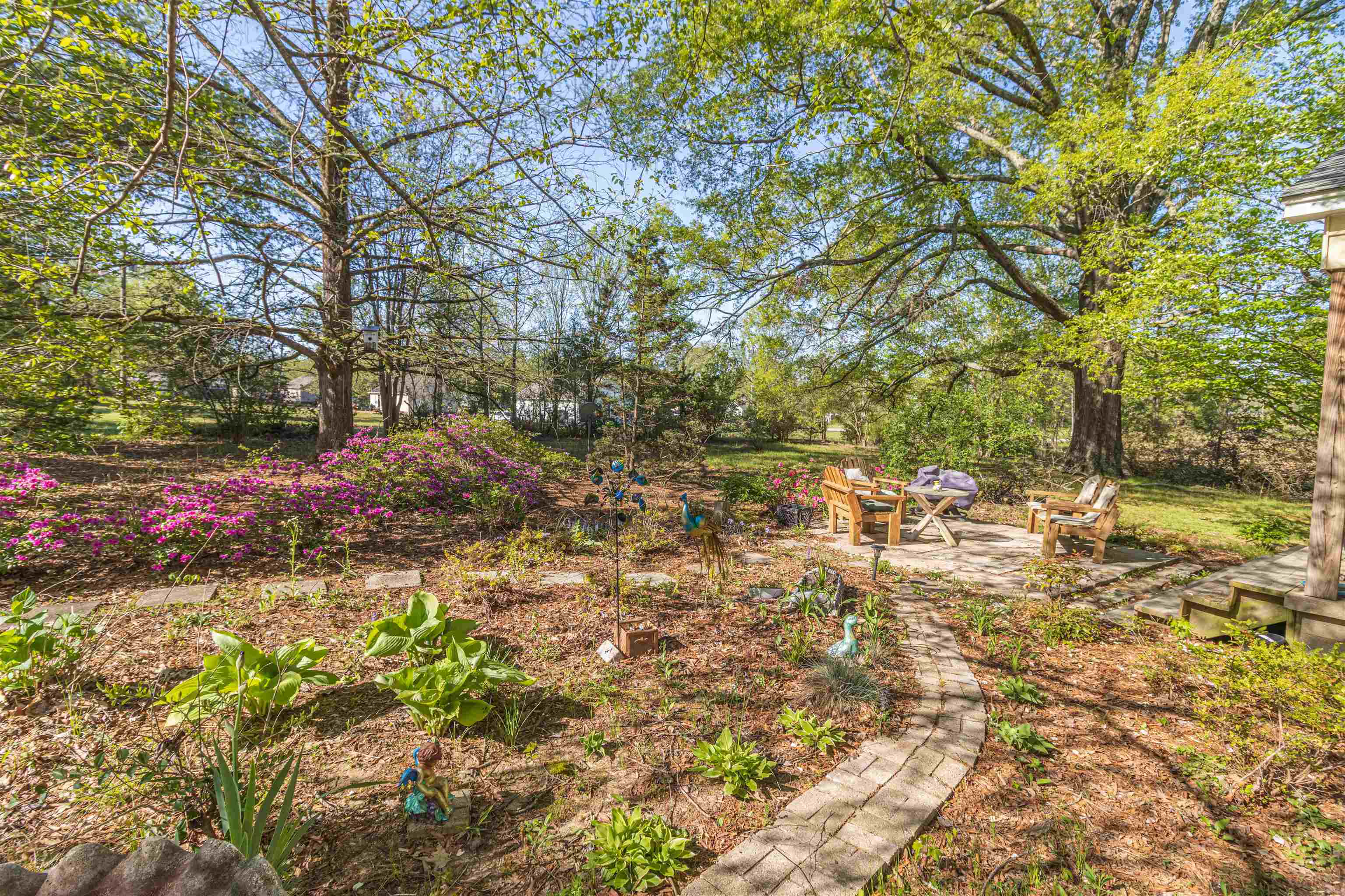 248 Mayflower Road Ramer, TN 38367 - Photo 4 of 31 a backyard of a house with a yard and outdoor seating