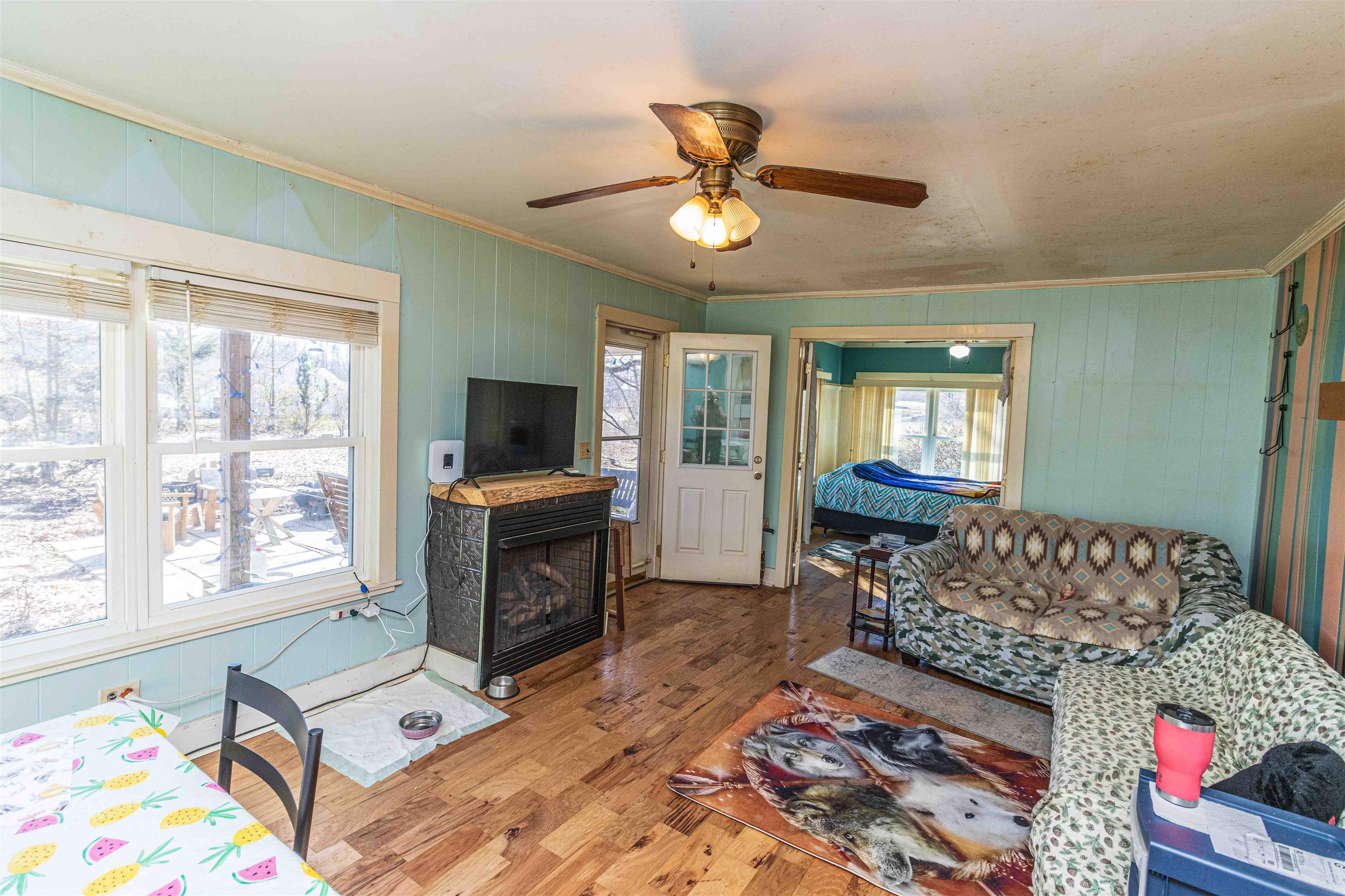 248 Mayflower Road Ramer, TN 38367 - Photo 10 of 31 a living room with furniture and a flat screen tv