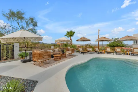 a view of porch with a bench and floor to ceiling window