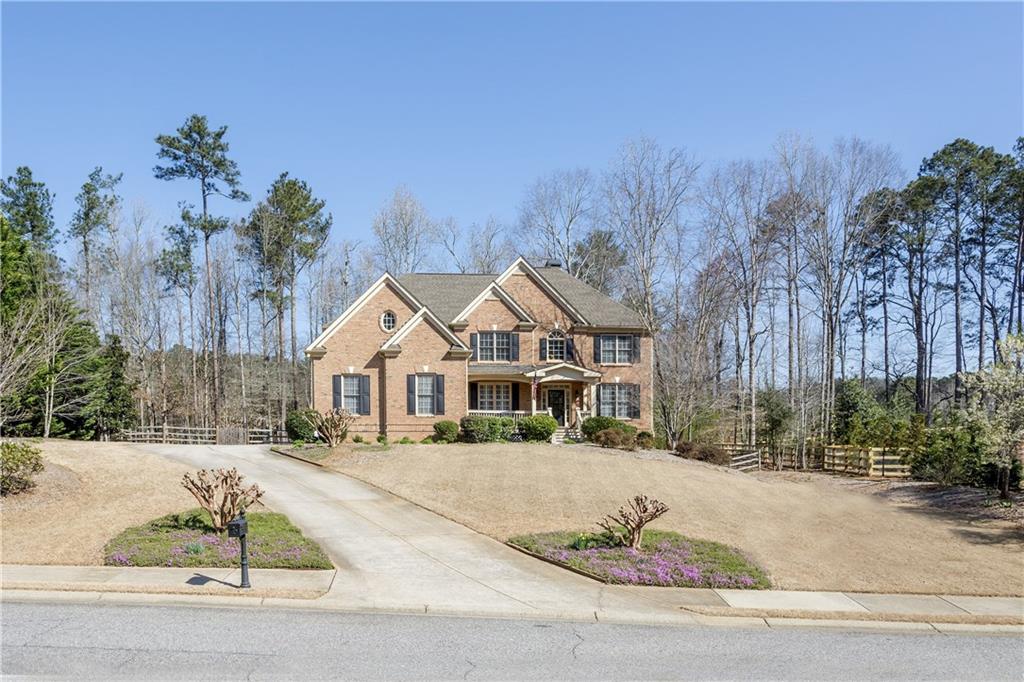 124 Laurel Ridge Drive Alpharetta, GA 30004 - Photo 1 of 1 Stately brick & cement sided home situated on a beautiful wooded lot! Minutes to Milton, Woodstock and Canton! Great Location!