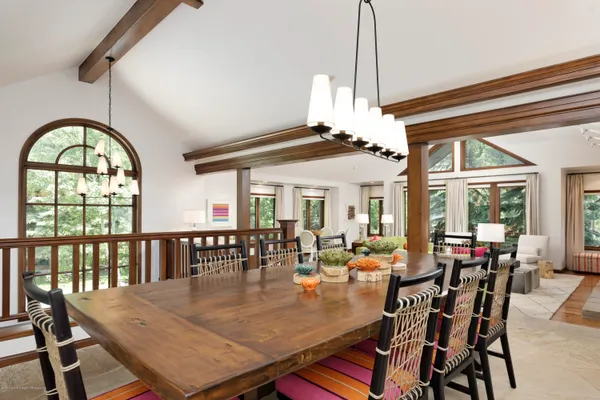 a view of a dining room with furniture window and outside view