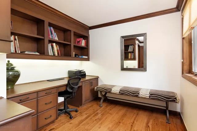 a bedroom with a bed and a bookshelf