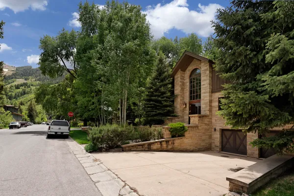 a view of car parked in front of house