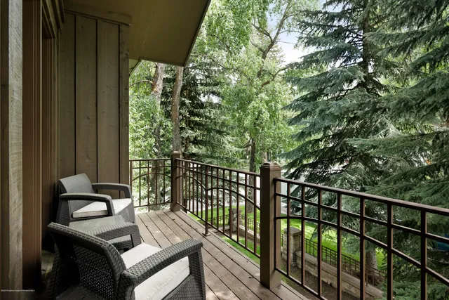 a view of balcony with furniture