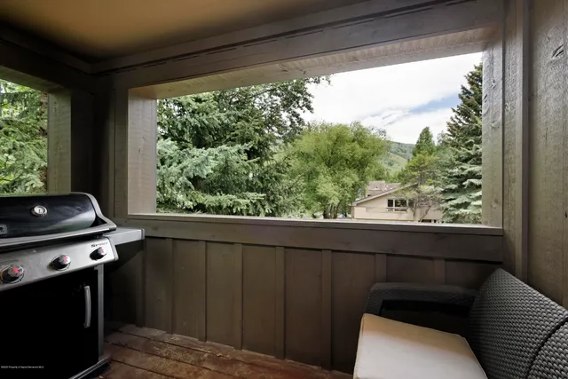 a view of a hardwood floor and a potted plant