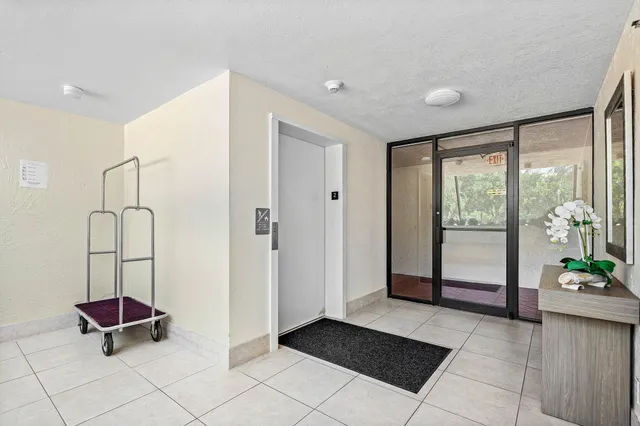 a view of an entryway with wooden floor