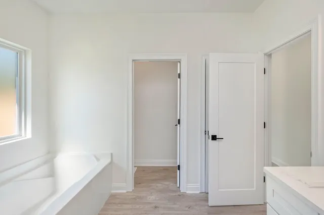a bathroom with a bathtub and a sink