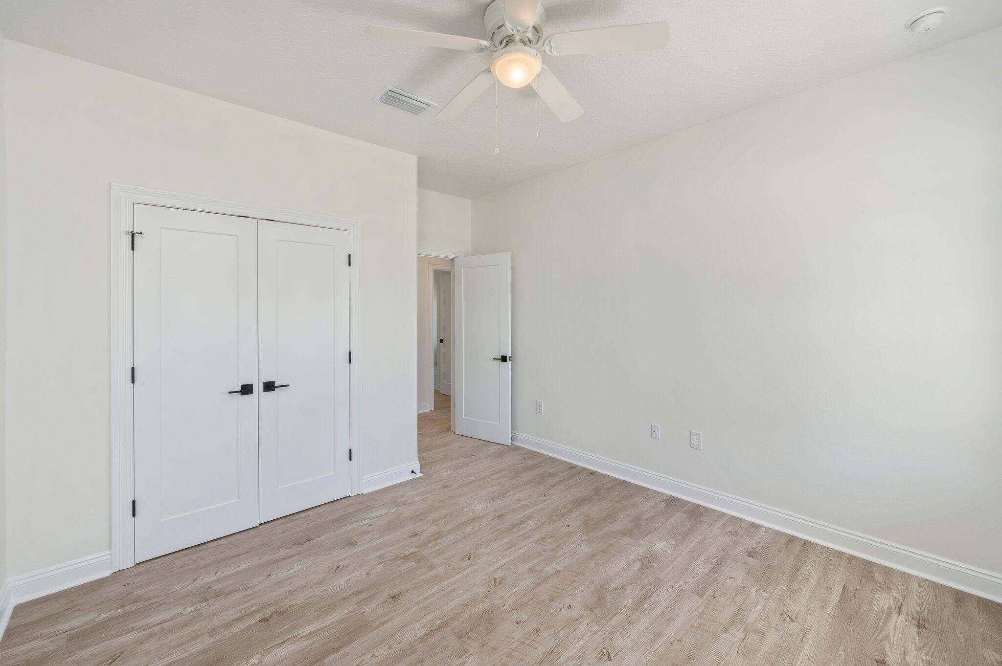 5448 Jenee Court Crestview, FL 32539 - Photo 28 of 42 a view of an empty room with chandelier fan