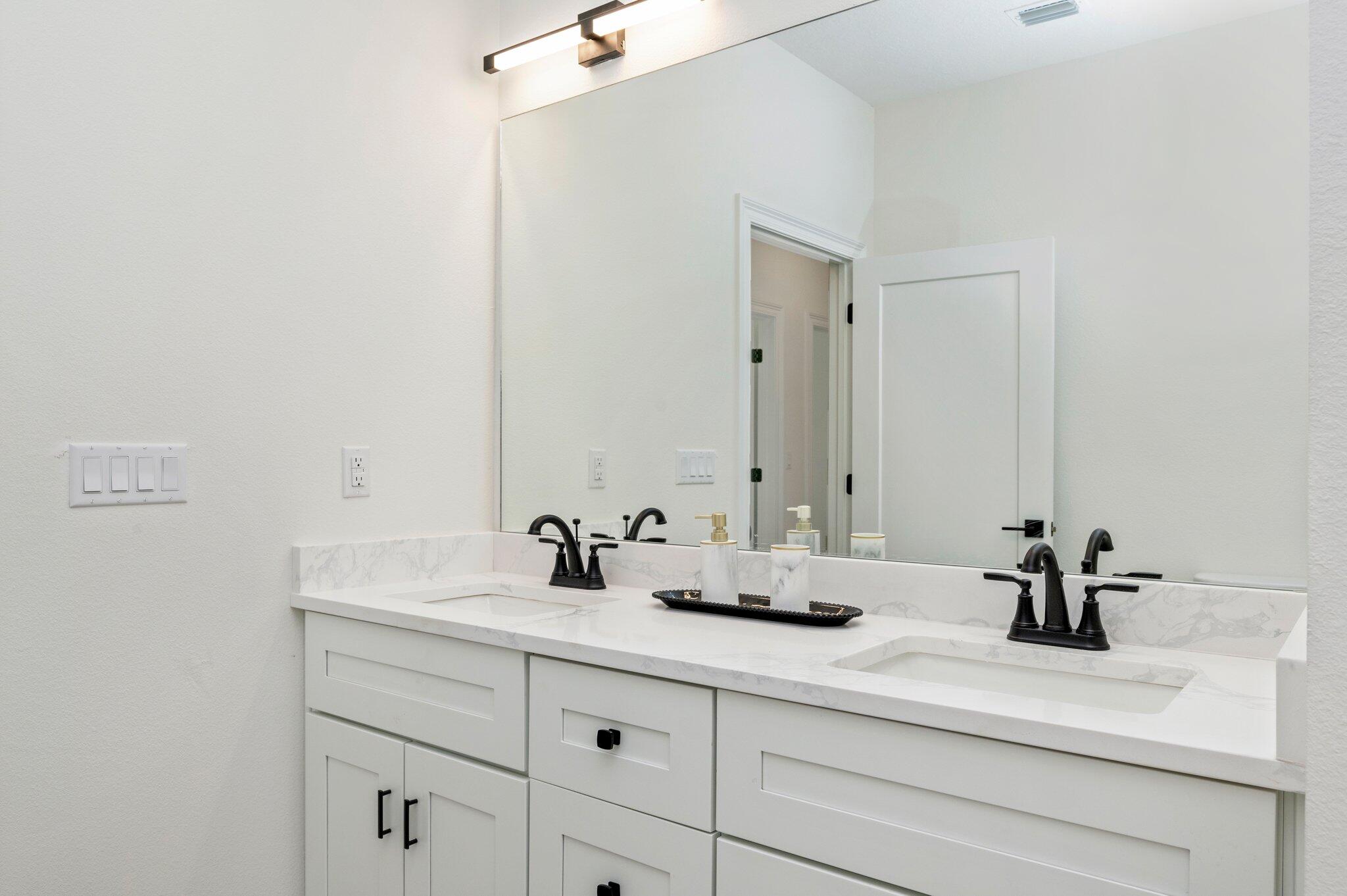 5448 Jenee Court Crestview, FL 32539 - Photo 33 of 42 a bathroom with a sink and a mirror