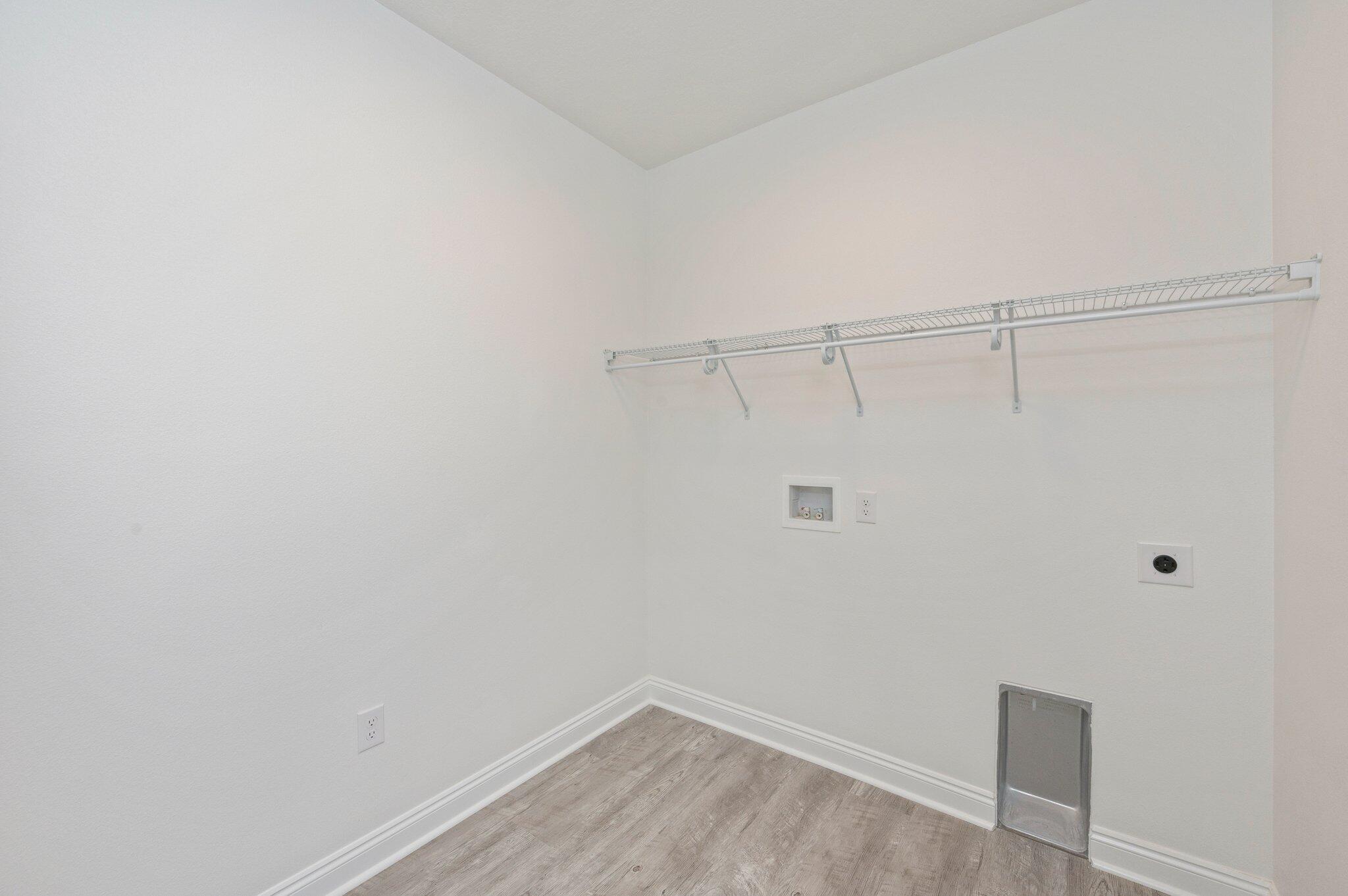 5448 Jenee Court Crestview, FL 32539 - Photo 35 of 42 a view of a room with racks on the wall