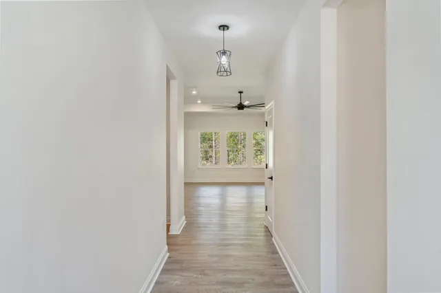 a view of a hallway with a window