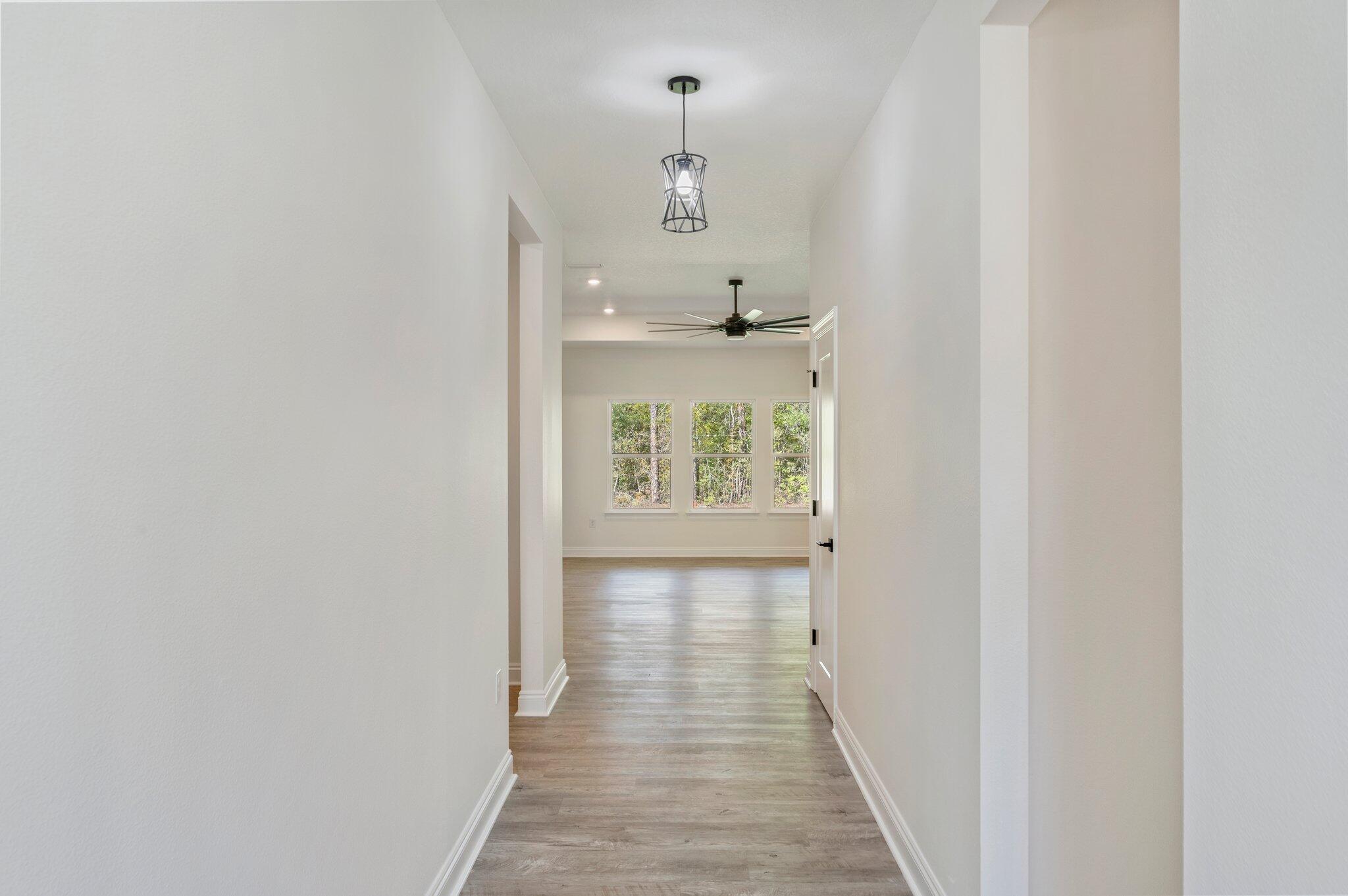 5448 Jenee Court Crestview, FL 32539 - Photo 6 of 42 a view of a hallway with a window