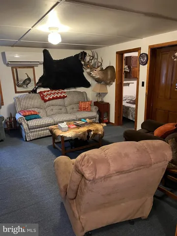 a view of kitchen with refrigerator stove and a sink