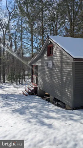 a view of a building with a bench in front of house