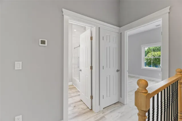 a view of a hallway with front door