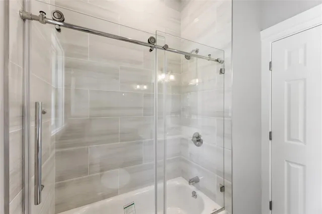 a bathroom with a shower and a bathtub
