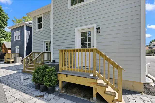 a view of a house with wooden fence