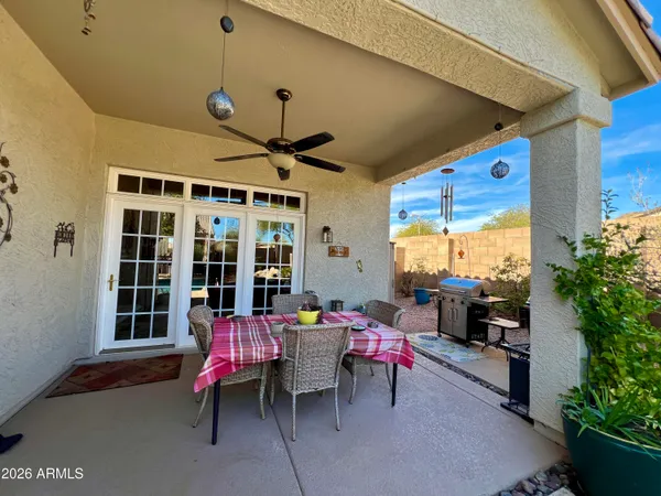 a reading room with furniture and a large window
