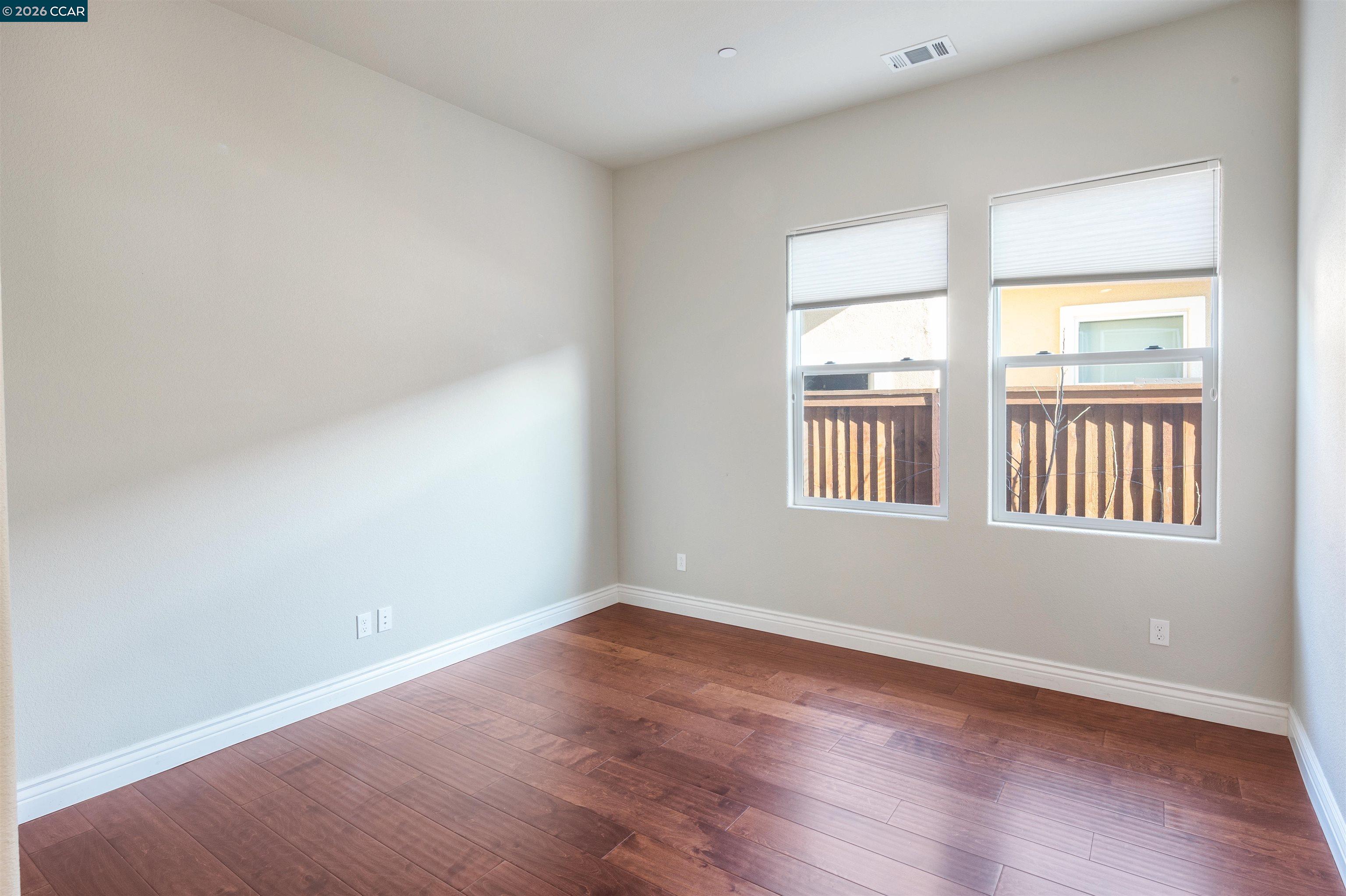 2090 Rioja Way Brentwood, CA 94513 - Photo 43 of 48 a view of an empty room with wooden floor and a window
