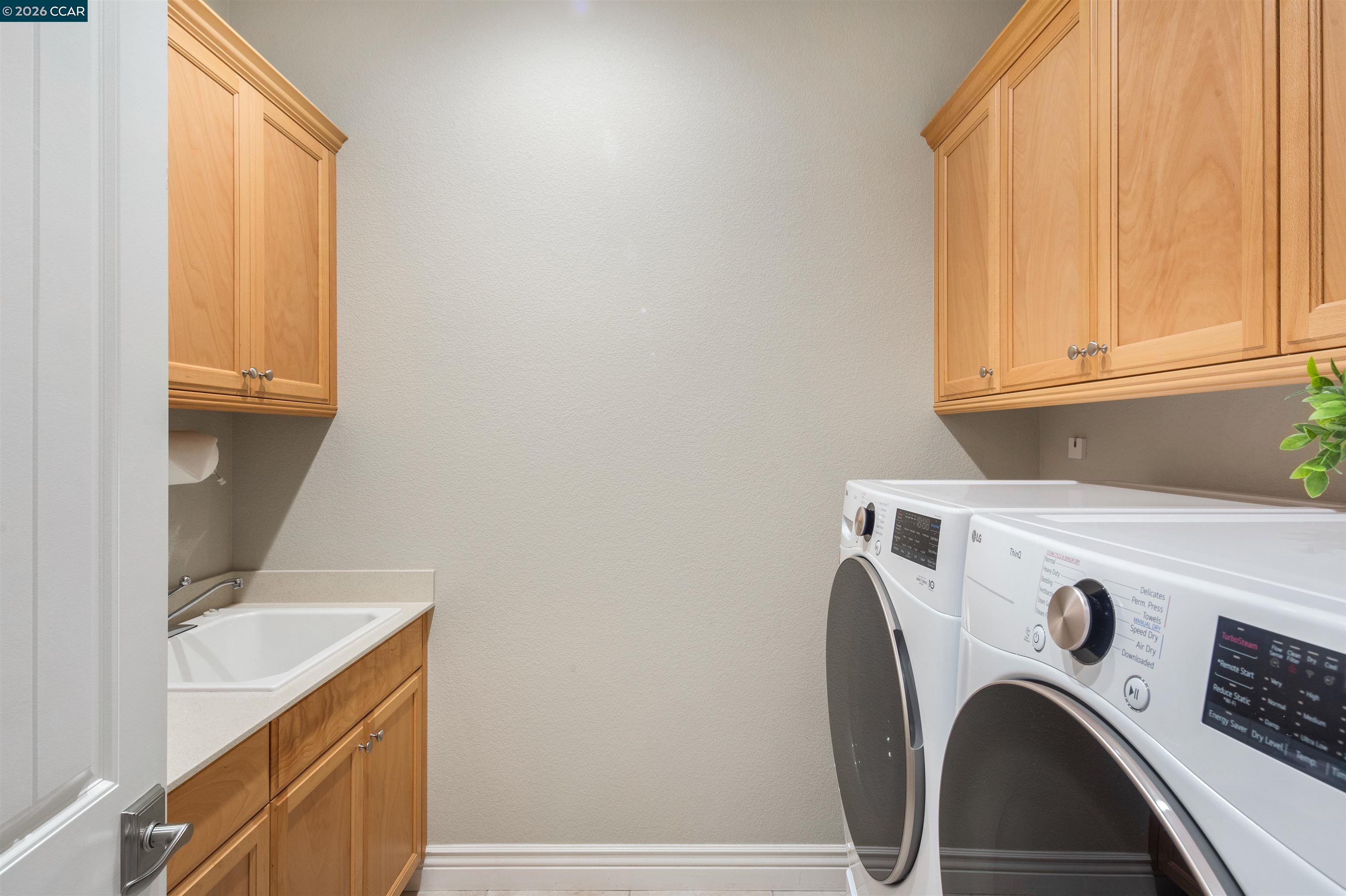 2090 Rioja Way Brentwood, CA 94513 - Photo 45 of 48 a utility room with dryer and washer