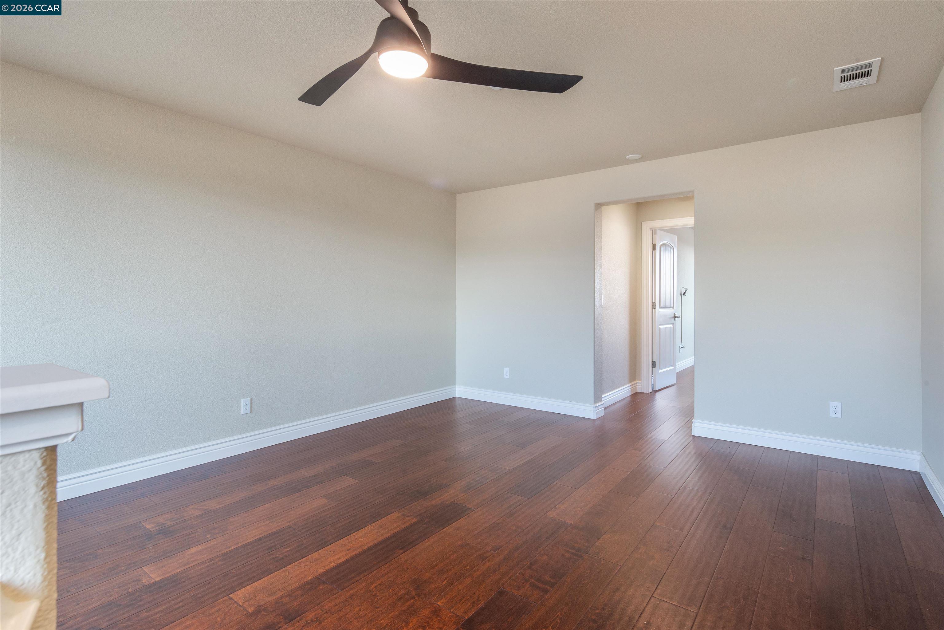 2090 Rioja Way Brentwood, CA 94513 - Photo 47 of 48 an empty room with wooden floor and windows