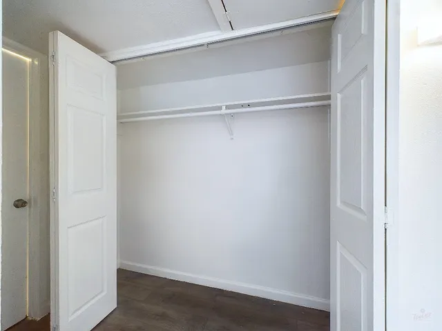 a view of an empty walk in closet