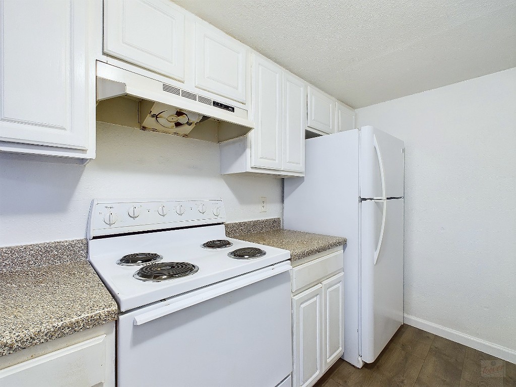 2124 Burton Drive, Unit 140 Austin, TX 78741 - Photo 9 of 22 a kitchen with a refrigerator a stove and a sink
