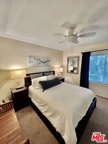 a bed room with a bed and a lamp