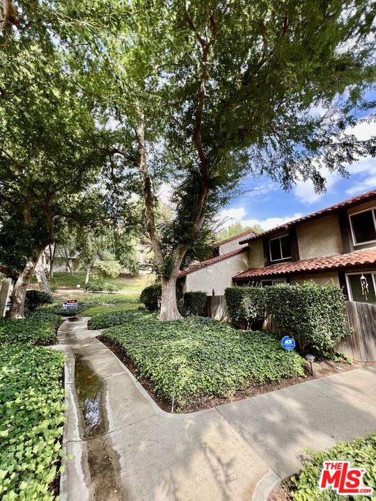 27574 Rondell Street Agoura Hills, CA 91301 - Photo 20 of 26 a front view of a house with a yard