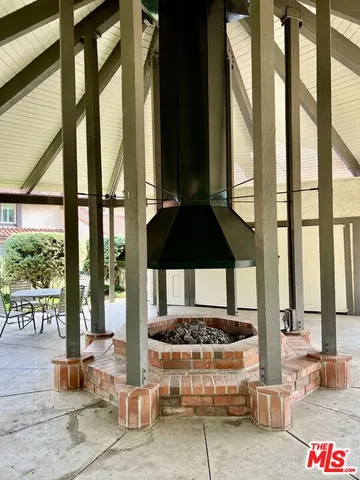 a living room with a large window and a table