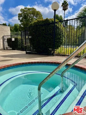 a view of swimming pool from a balcony