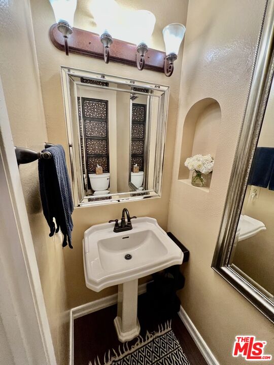 27574 Rondell Street Agoura Hills, CA 91301 - Photo 4 of 26 a bathroom with a sink and a mirror