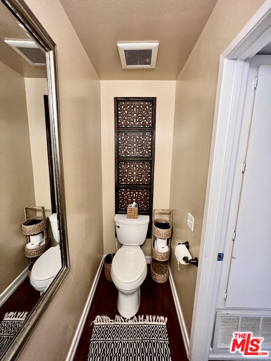 27574 Rondell Street Agoura Hills, CA 91301 - Photo 5 of 26 a bathroom with a toilet and a shower