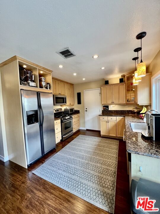 27574 Rondell Street Agoura Hills, CA 91301 - Photo 6 of 26 a kitchen with granite countertop a refrigerator oven a sink and dishwasher