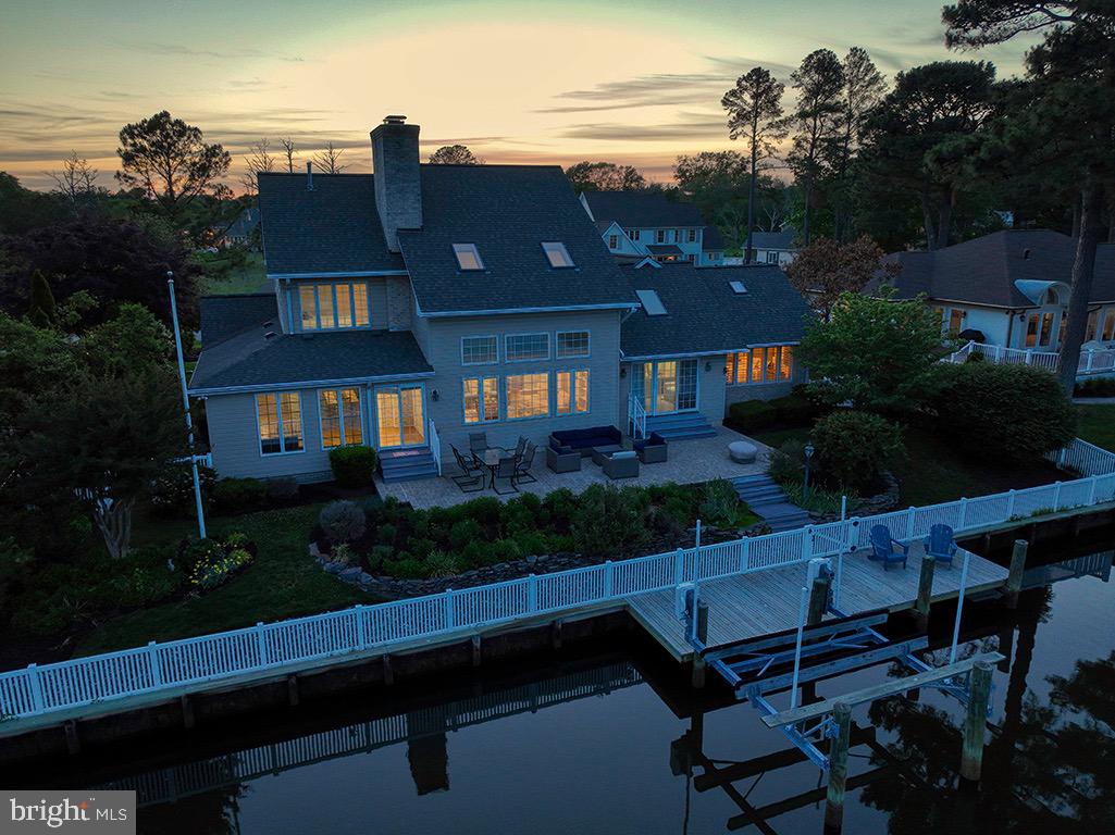 23 Sheffield Road Rehoboth Beach, DE 19971 - Photo 2 of 100 View of back yard and deck at night.