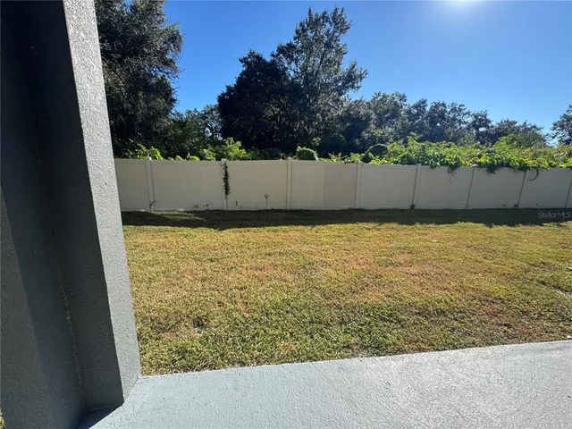 a view of a swimming pool and an outdoor space