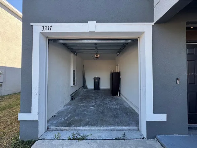 a view of a hallway with wooden shelves